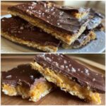 Close-up of rich saltine cracker toffee bars layered with caramel and dark chocolate, topped with flaky sea salt.